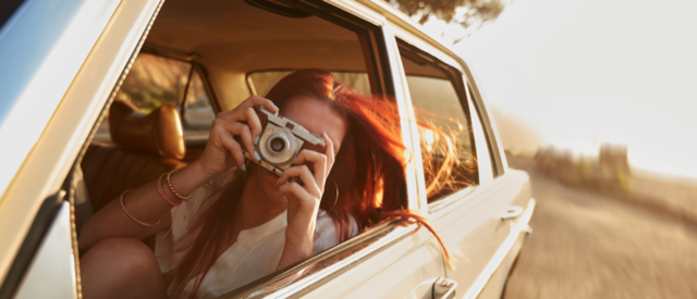 Tourist on a road trip taking pictures.